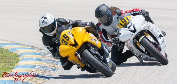 Joshua Mckillip and Adrian Mitchell racing motorcycles at Homestead Speedway